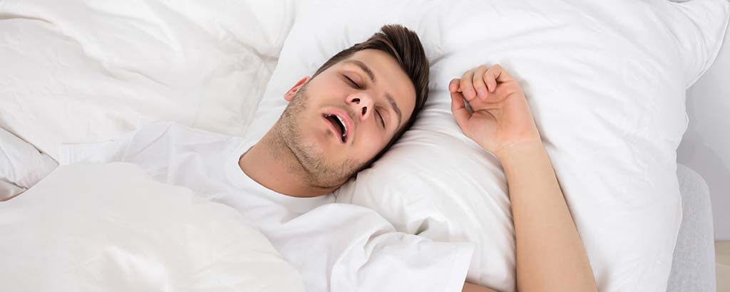 a man sleeps and snores