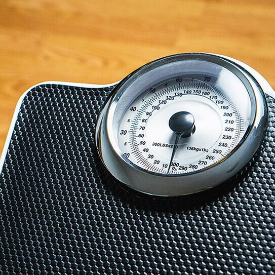 a scale reminds people of oral health and weight loss