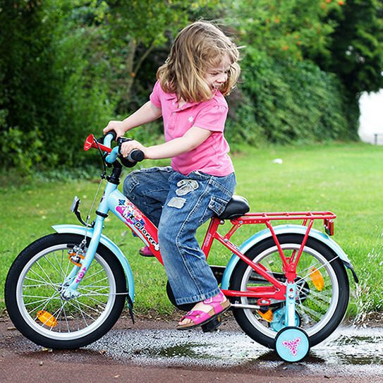 a little girl riding a bike wonders are you prepared for a dental emegency