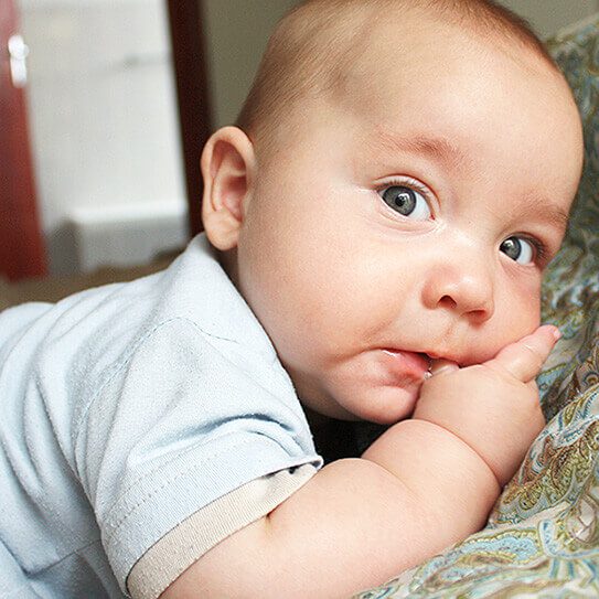 a baby sucking his thumb makes his parents think about what they need to know about thumb sucking