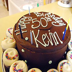 a birthday cake indicates five dental issues for people over 50